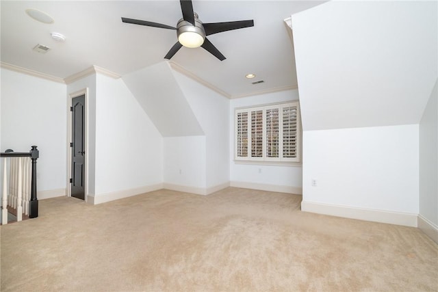 bonus room featuring ceiling fan, light carpet, and vaulted ceiling