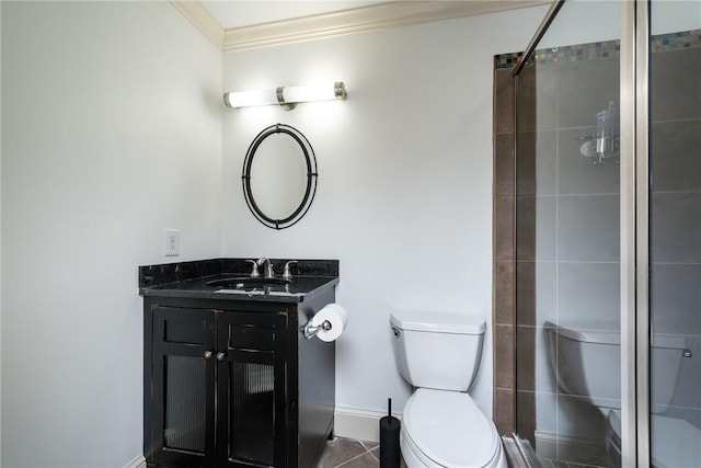 bathroom featuring tile patterned floors, an enclosed shower, vanity, crown molding, and toilet