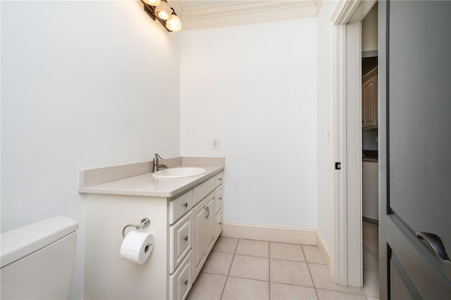 bathroom featuring toilet, vanity, and tile patterned floors