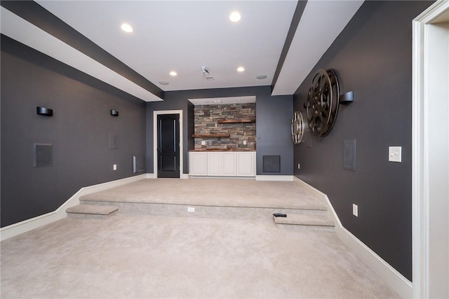 unfurnished living room featuring carpet