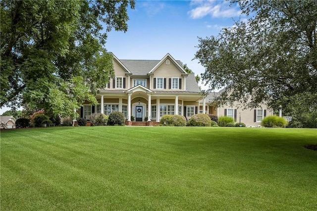 view of front facade with a porch and a front lawn