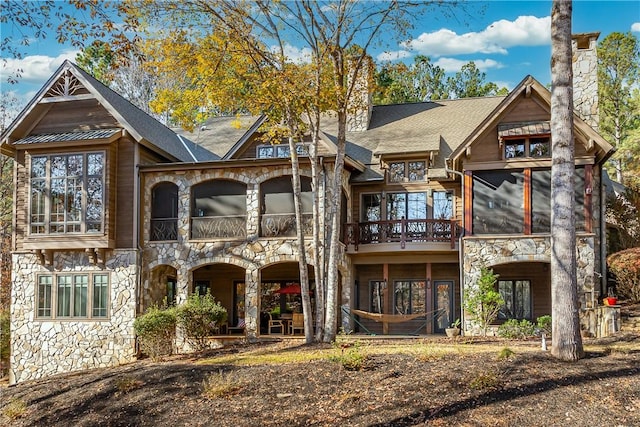 rear view of house with a balcony