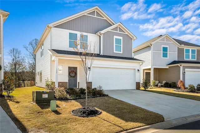 view of front of home featuring a garage and a front yard