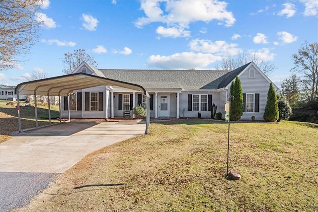 view of front of property with a front lawn and a carport