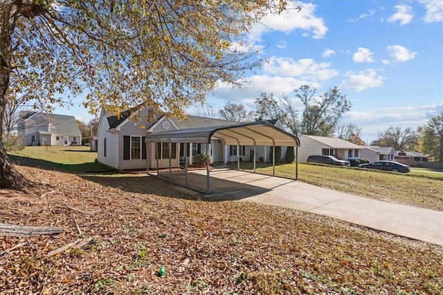 view of front of property featuring a front yard and a carport