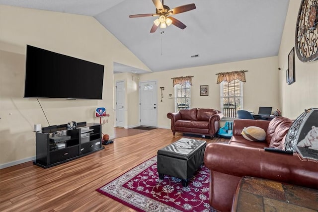 living room with ceiling fan, wood-type flooring, and lofted ceiling