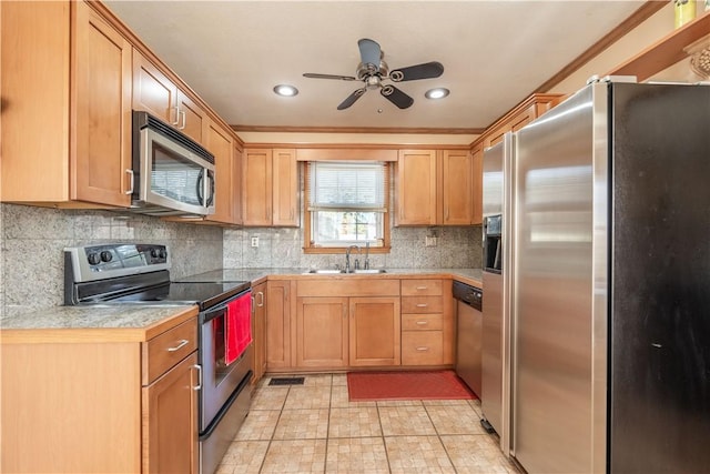 kitchen with ceiling fan, sink, tasteful backsplash, light tile patterned floors, and appliances with stainless steel finishes