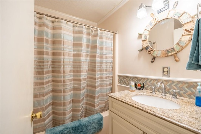 bathroom with vanity, crown molding, walk in shower, and tasteful backsplash