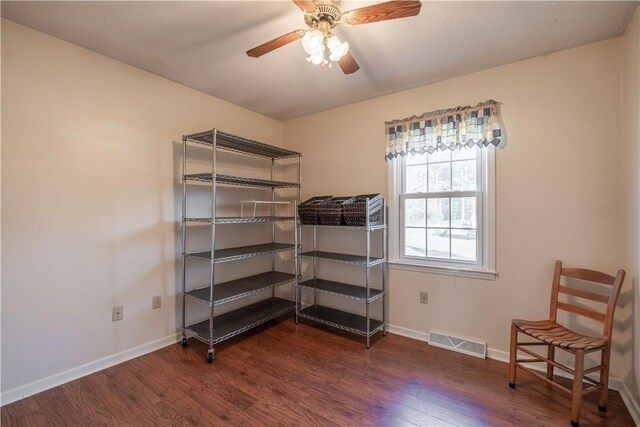 interior space with ceiling fan