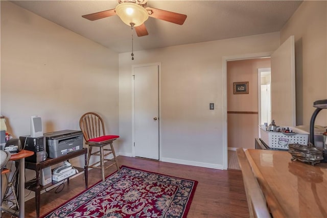 interior space with ceiling fan and dark wood-type flooring