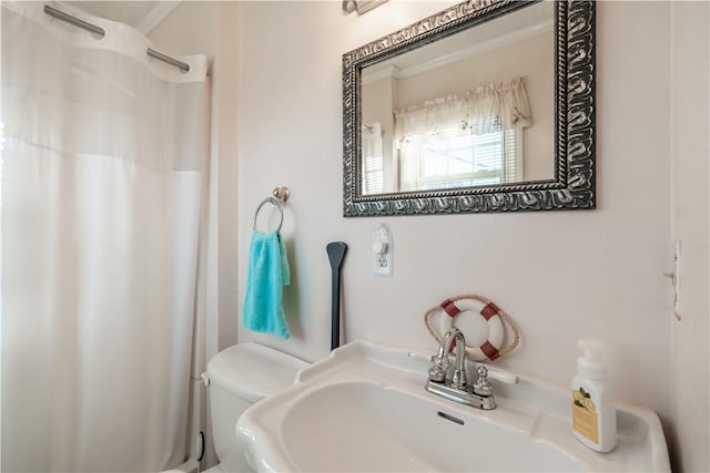 bathroom featuring sink and toilet