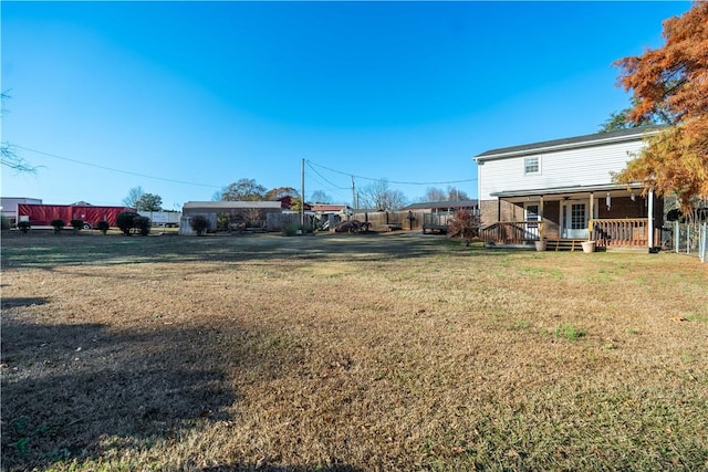 view of yard with covered porch