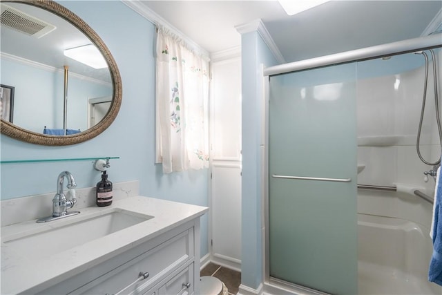 bathroom featuring vanity, toilet, walk in shower, and ornamental molding