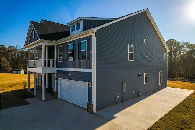 view of property exterior with a garage and a sunroom