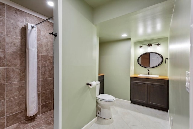 bathroom featuring toilet, vanity, tile patterned floors, and walk in shower