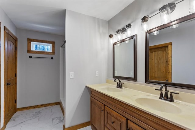 bathroom with vanity and a shower