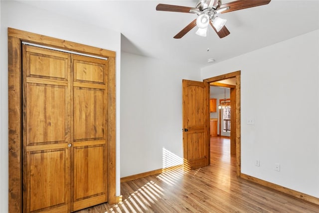 interior space with ceiling fan and light wood-type flooring