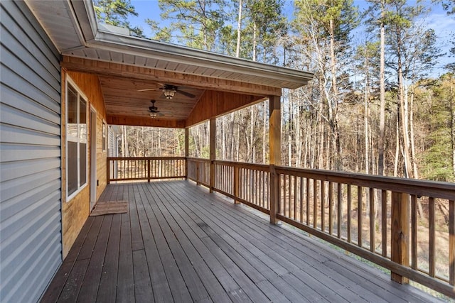 wooden terrace featuring ceiling fan