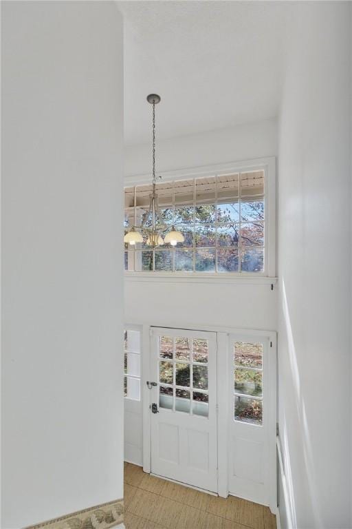 entryway featuring a chandelier