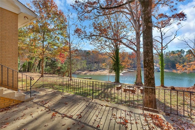 wooden deck featuring a water view