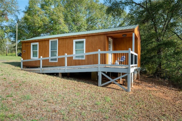1401 Lebanon Rd, Pendleton, SC 29670 - view of front of home featuring a deck, metal roof, and a front yard