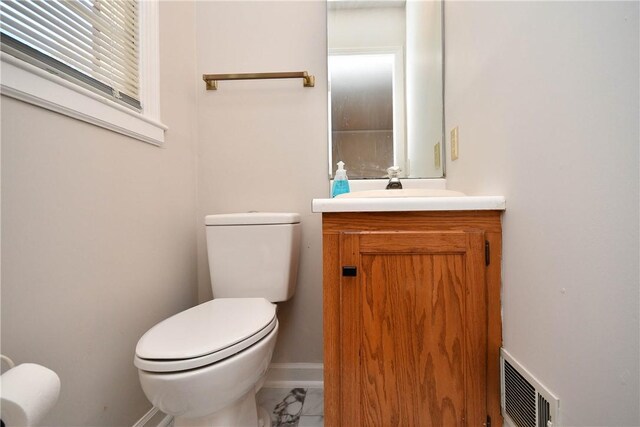 bathroom with vanity and toilet