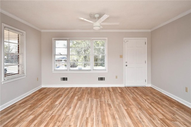 unfurnished room with ceiling fan, light hardwood / wood-style floors, and crown molding