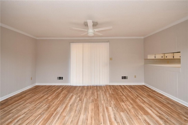 empty room with light hardwood / wood-style flooring, ceiling fan, and ornamental molding