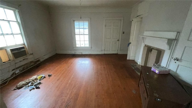 unfurnished living room featuring dark hardwood / wood-style floors