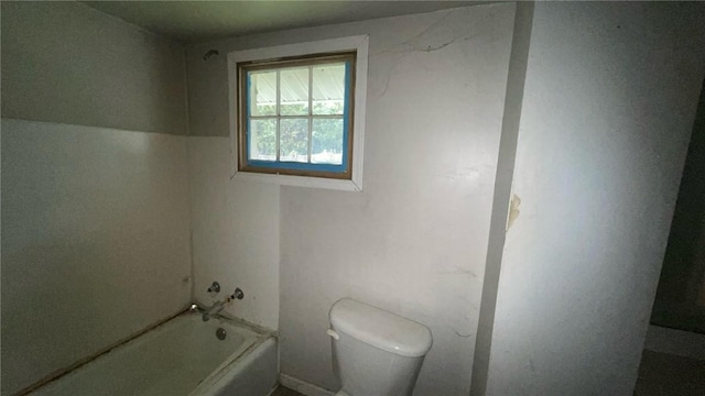 bathroom featuring shower / tub combination and toilet