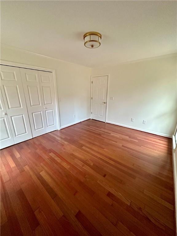 empty room featuring wood-type flooring