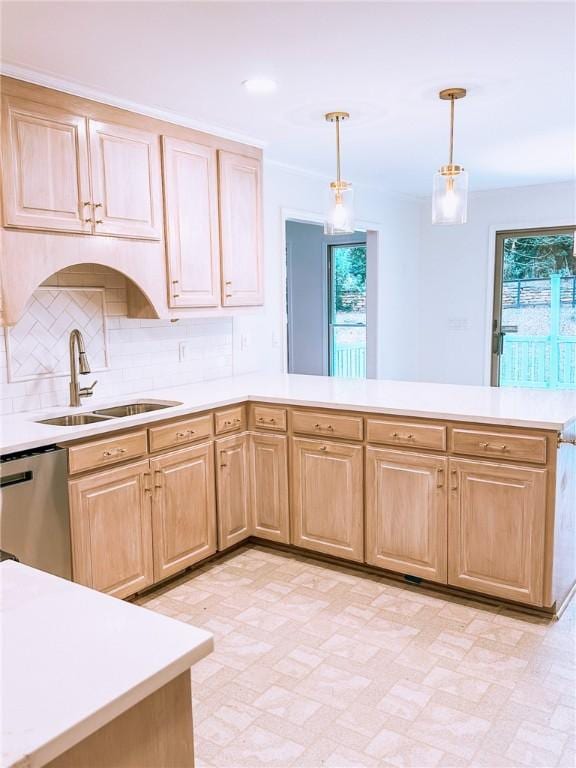 kitchen with kitchen peninsula, decorative backsplash, sink, pendant lighting, and dishwasher