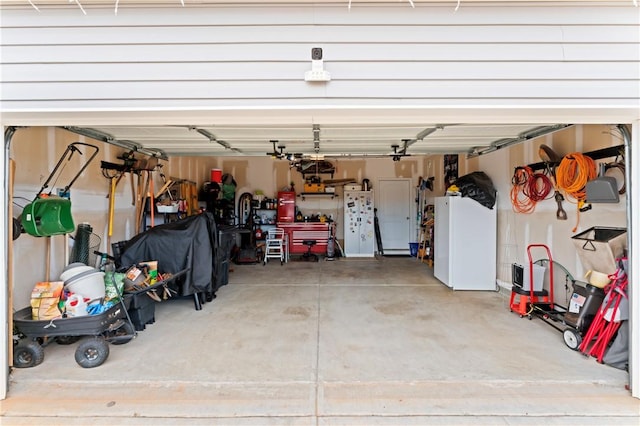 garage with white fridge