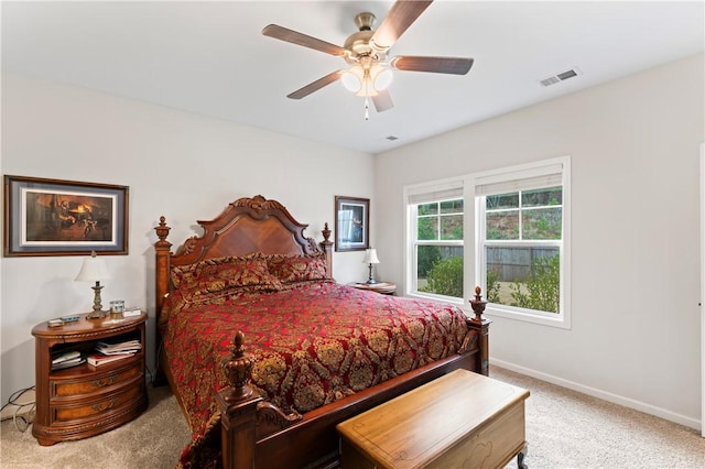 bedroom with ceiling fan and light colored carpet