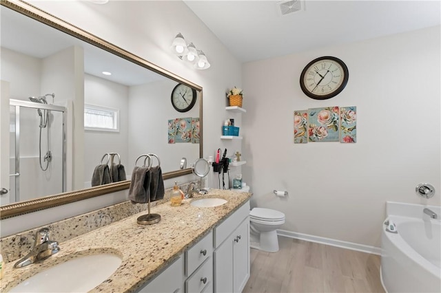 bathroom with vanity, hardwood / wood-style flooring, and separate shower and tub