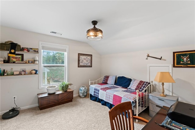 bedroom with carpet flooring and lofted ceiling