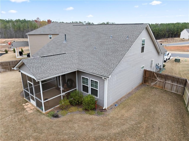 back of house featuring a sunroom