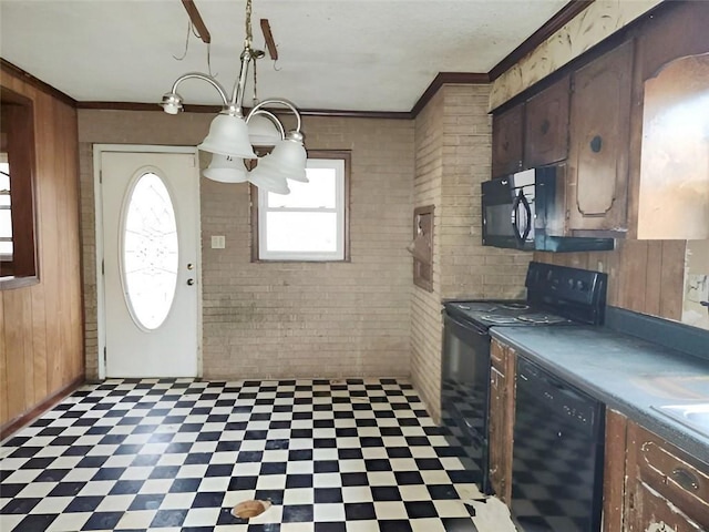 kitchen featuring brick wall, ornamental molding, wooden walls, and black appliances