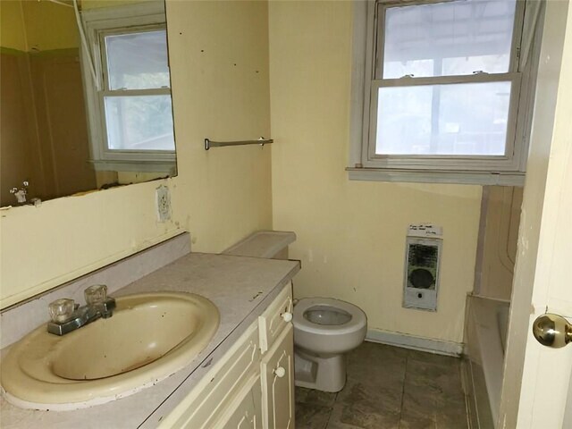 409 Simpson St, Westminster, SC 29693 - bathroom featuring healthy amount of natural light, vanity, a tub to relax in, and tile patterned flooring