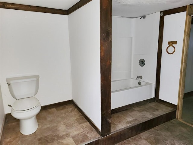 bathroom with shower / bath combination and toilet