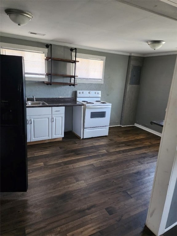 kitchen featuring dark wood-type flooring, white range with electric cooktop, white cabinets, black refrigerator, and ornamental molding