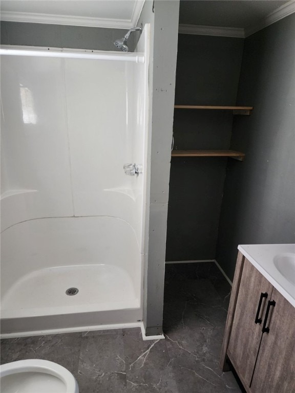 bathroom featuring walk in shower, toilet, vanity, and ornamental molding