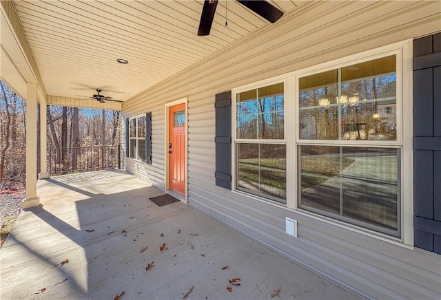 wooden deck featuring ceiling fan and a porch