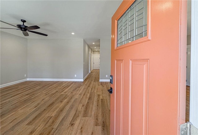 entrance foyer with ceiling fan and light hardwood / wood-style flooring