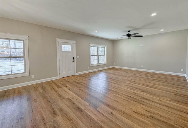 entrance foyer featuring ceiling fan and light hardwood / wood-style floors