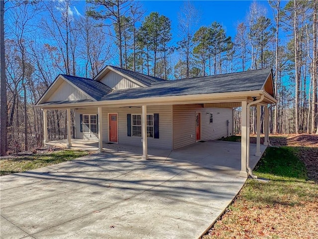 single story home with covered porch and a carport