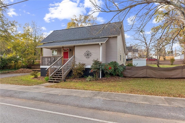 bungalow-style house with a front lawn