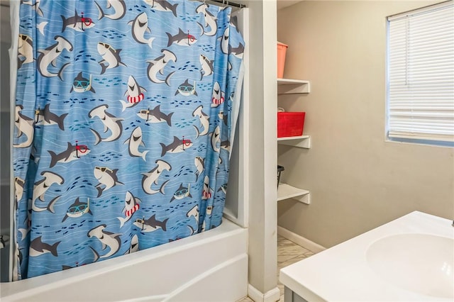 bathroom with vanity and shower / tub combo with curtain