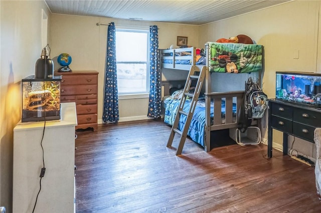 bedroom with dark wood-type flooring