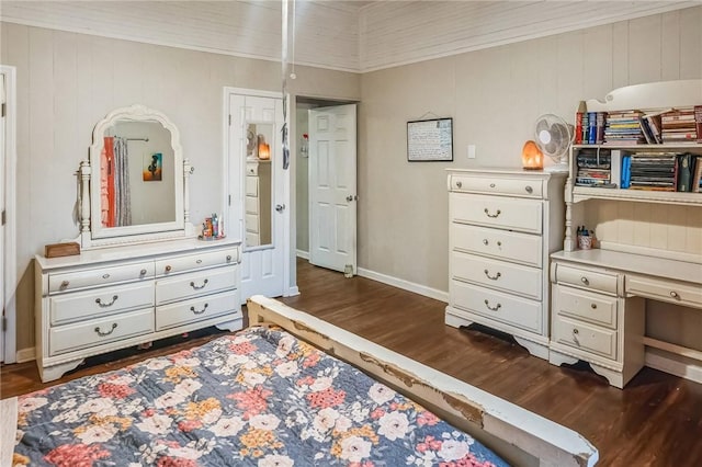 bedroom with dark hardwood / wood-style flooring, ornamental molding, and wooden walls